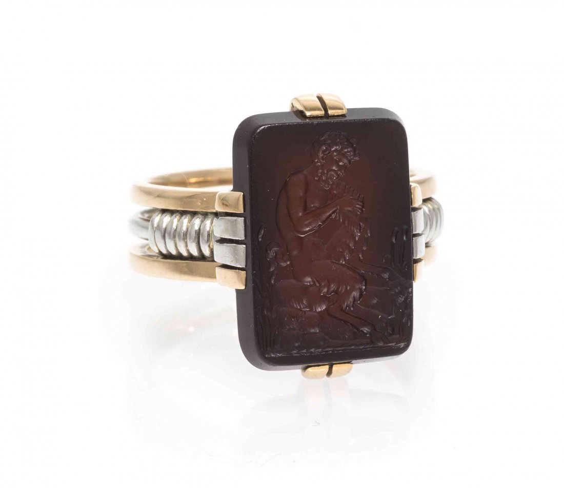 A 14 Karat Gold and Sardonyx Intaglio Ring, 6.60 dwts.: A 14 Karat Gold and Sardonyx Intaglio Ring, consisting of a rectangular sardonyx intaglio depicting Pan measuring approximately 17.70 x 12.44 mm set within a rose and white gold ring. 6.60 dwts.