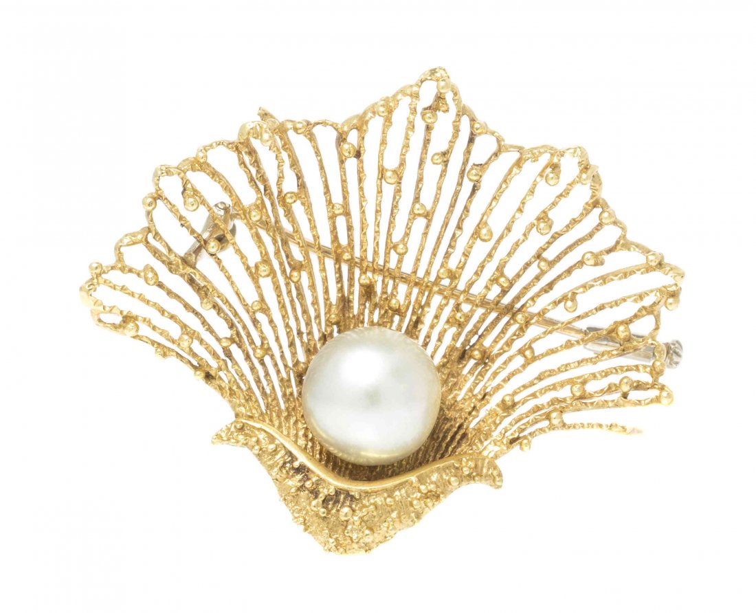 An 18 Karat Yellow Gold and Cultured Pearl Seashell: An 18 Karat Yellow Gold and Cultured Pearl Seashell Brooch, RHB, in a stylized oyster half shell textured openwork design, containing one pearl measuring approximately 11.50 mm in diameter. Stamp: 750