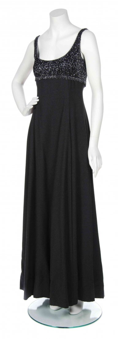 A George Halley Gray Wool Gown Ensemble,: A George Halley Gray Wool Gown Ensemble, comprised of a sleeveless gown with hematite beads to the bust, hidden front pockets together with a long sleeve button down bolero. Labeled: George Halley New