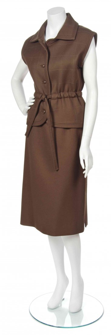 A Courreges Brown Wool Skirt Ensemble, Size B.: A Courreges Brown Wool Skirt Ensemble, Circa 1970, comprised of a sleeveless, button down waist tie vest with all-over topstitching in a square pattern, together with an A-line skirt with slits to the