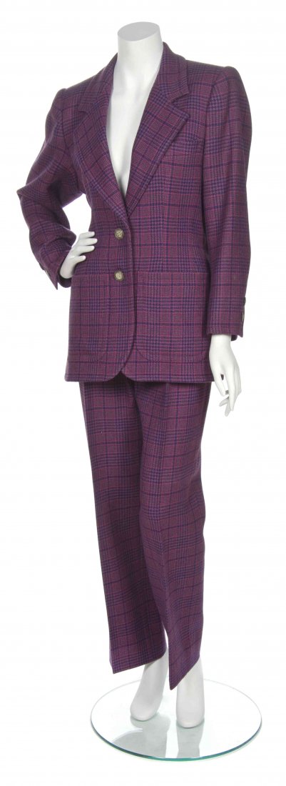 An Yves Saint Laurent Purple Four Piece Ensemble,: An Yves Saint Laurent Purple Four Piece Ensemble, circa 1980, comprised of a purple glen plaid single breasted jacket, together with a matching pleated pant, a purple wool fitted skirt and purple leat