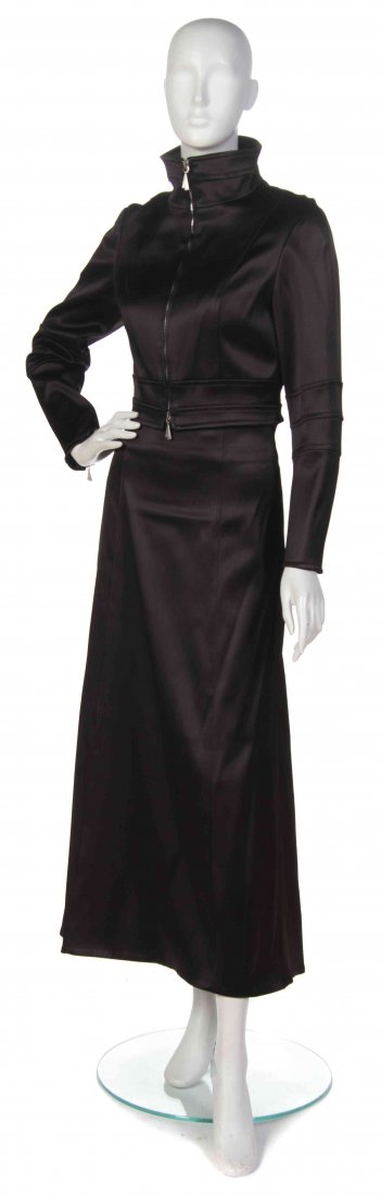 A Claude Montana Black Satin Ensemble, Size 44.: A Claude Montana Black Satin Ensemble, (French, b. 1949) comprised of a cropped zipper front jacket, together with a long A-line skirt. Labeled: Claude Montana. black satin size 44. Size 44. Property 