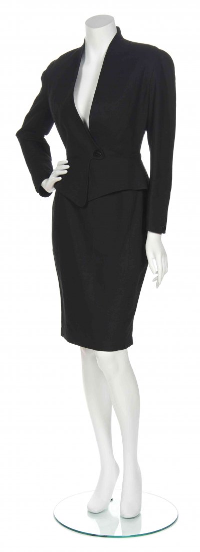 A Thierry Mugler Black Cotton Skirt Suit, Size 38.: A Thierry Mugler Black Cotton Skirt Suit, single snap button jacket with peplum waist together with fitted skirt. Labeled: Thierry Mugler. Size 38.