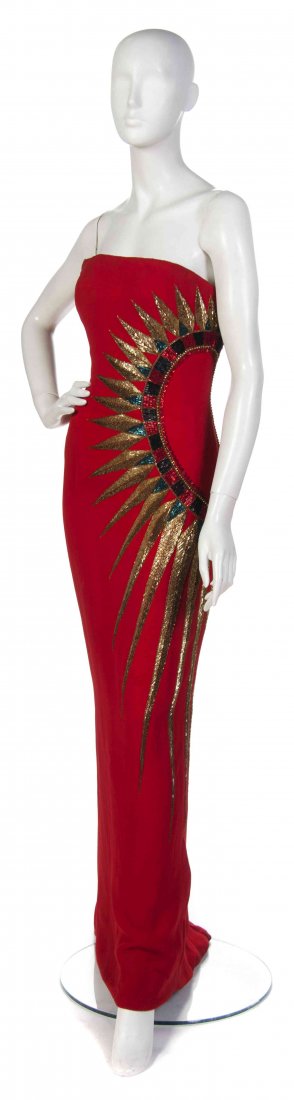 A Bob Mackie Red Gown,: A Bob Mackie Red Gown, (American, b. 1940) strapless with a sunburst multicolor beaded side. Labeled: Bob Mackie. red knit and multicolor beading size 10. Property from the Ebony Fashion Fair Collecti