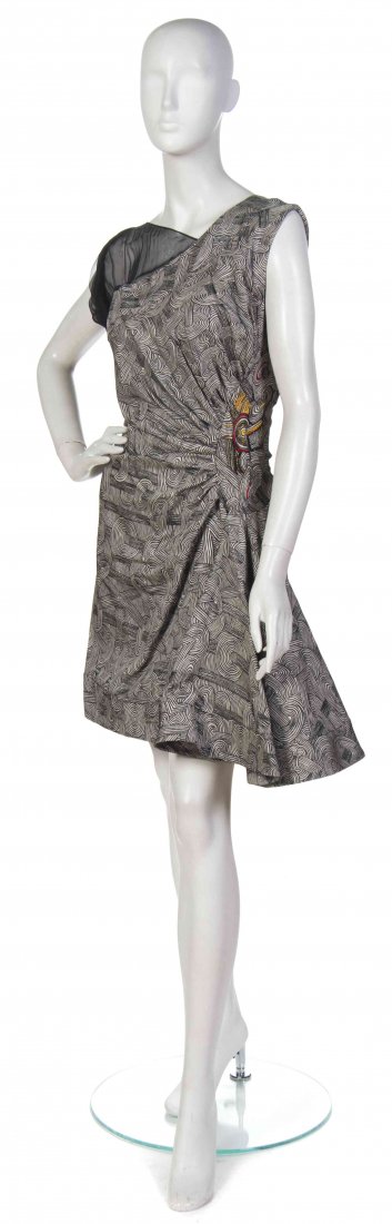 An Emanuel Ungaro Black and White Print Dress,: An Emanuel Ungaro Black and White Print Dress, (Italian, b. 1933) chiffon asymmetric panel to the neckline with a side gathered waist and asymmetric hem. Labeled: Emanuel Ungaro Paris. black and white