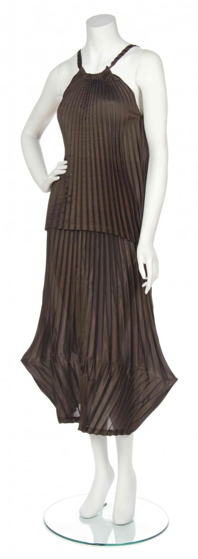 An Issey Miyake Brown Silk Accordion Pleated Skirt: An Issey Miyake Brown Silk Accordion Pleated Skirt Ensemble, comprised of a sleeveless top, together with an origami effect hem skirt. Labeled: Issey Miyake White Label. Size 2.