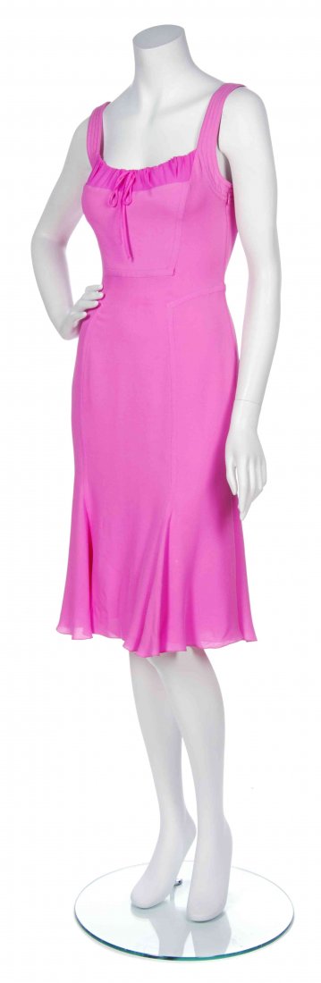 A Gianni Versace Bright Pink Crepe Cocktail Dress, Size: A Gianni Versace Bright Pink Crepe Cocktail Dress, with a drawstring neckline and flutes to the hem. Labeled: Gianni Versace Couture. Size 40.