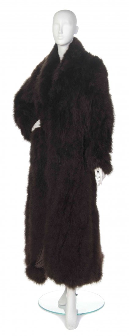 A Christian Dior Brown Turkey Feather Coat. Size 10.: A Christian Dior Brown Turkey Feather Coat. (French) Labeled: Christian Dior. brown turkey feathers size 10. Size 10. Property from the Ebony Fashion Fair Collection, Chicago, Illinois