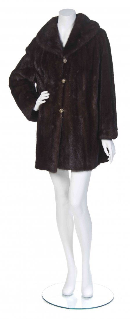 A Dark Brown Mink Coat,: A Dark Brown Mink Coat, with goldtone filigree buttons. Labeled: Javurek Furs Berwyn, Ill.