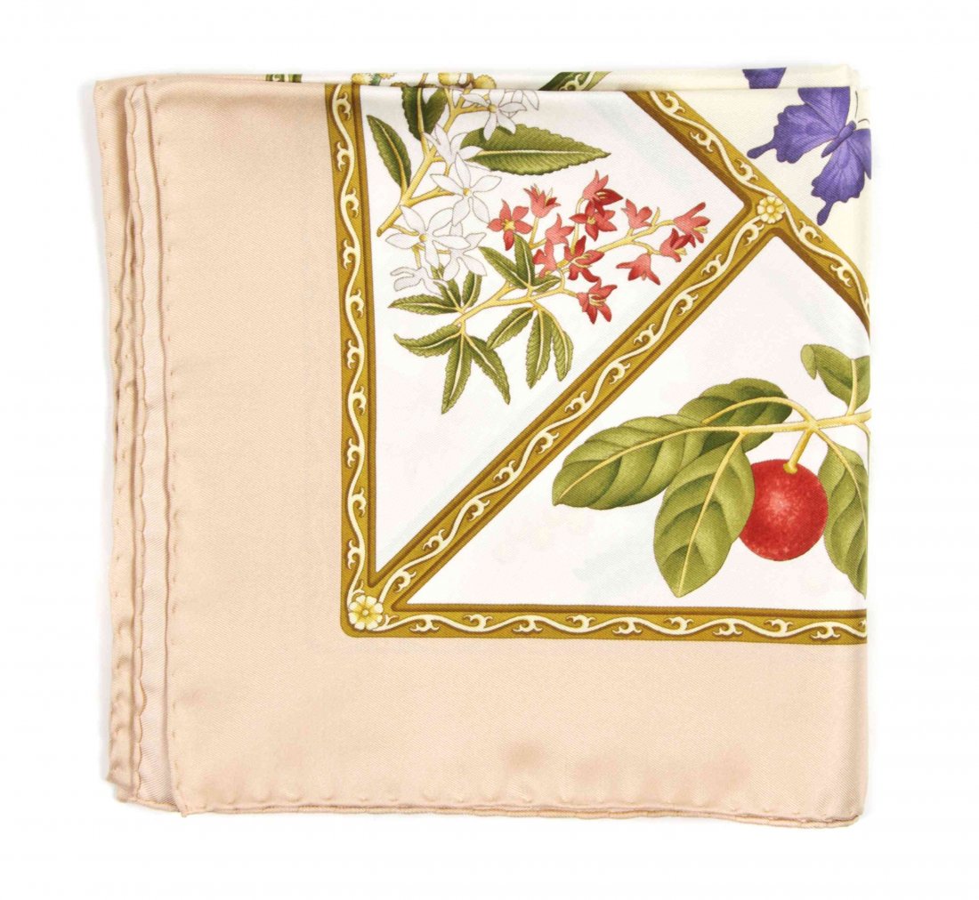 A Salvatore Ferragamo Silk Scarf, 35 x 35 inches.: A Salvatore Ferragamo Silk Scarf, in a flora and fauna motif. Labeled within print: Salvatore Ferragamo. 35 x 35 inches. Property from the Estate of Louis M. and Linda M. Byron, Tucson, Arizona