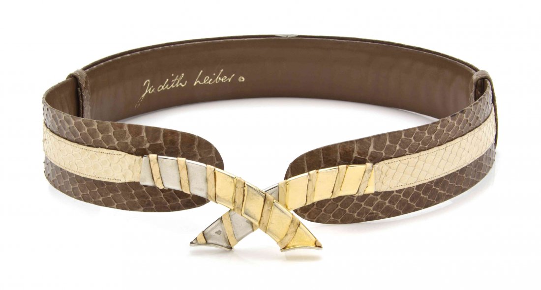 A Judith Leiber Brown and Tan Snakeskin Belt,: A Judith Leiber Brown and Tan Snakeskin Belt, center tan strap with goldtone crossover hardware buckle and adjustable belt strap. Stamped: Judith Leiber.