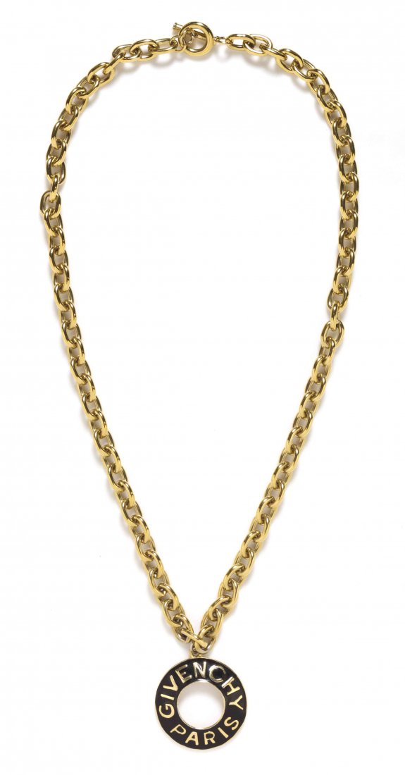 A Givenchy Goldtone Necklace,: A Givenchy Goldtone Necklace, chain link necklace with black and goldtone Givenchy Paris stamped pendant. Stamped: Givenchy. Property from the Collection of Carole Tanenbaum