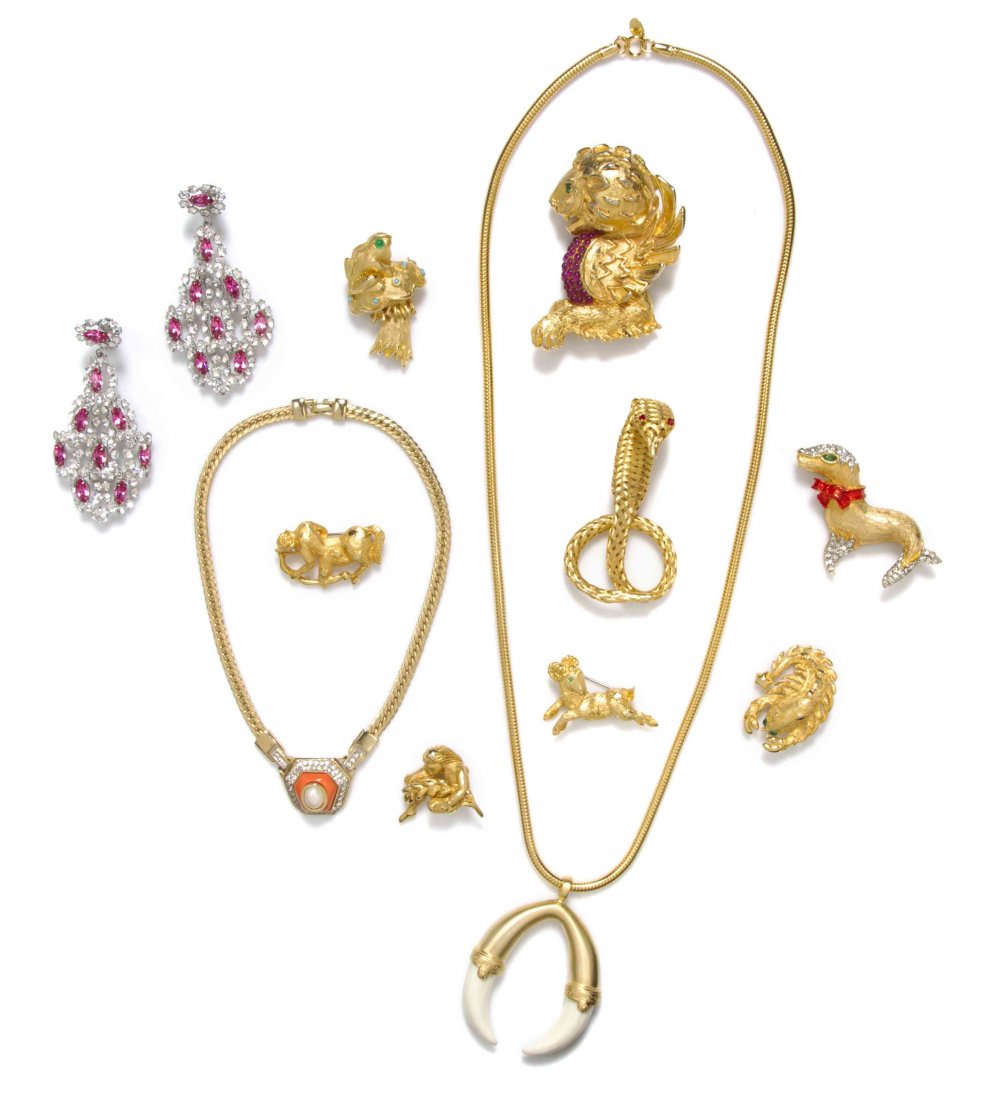 A Group of Kenneth Jay Lane Costume Jewelry,: A Group of Kenneth Jay Lane Costume Jewelry, comprised of eight brooches all stamped K.J.L., a pair of silvertone and rhinestone chandelier ear pendants stamped K.J.L. and two necklaces stamped Kennet