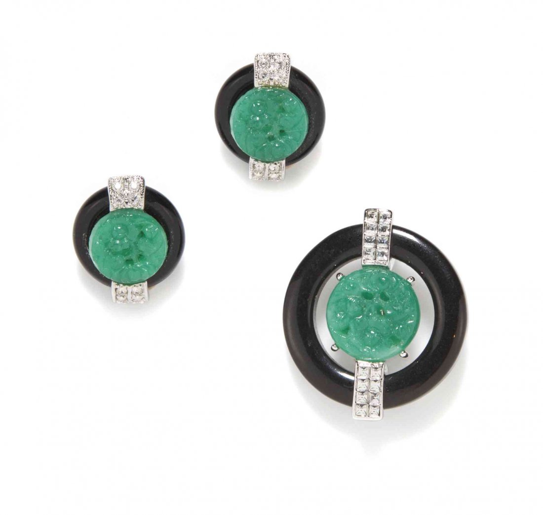 A Kenneth Jay Lane Black Enamel and Faux Jade Suite,: A Kenneth Jay Lane Black Enamel and Faux Jade Suite, comprised of a brooch and a pair of earclips with carved faux jade medallions surrounded by a ring of black enamel and rhinestone embellishments. S