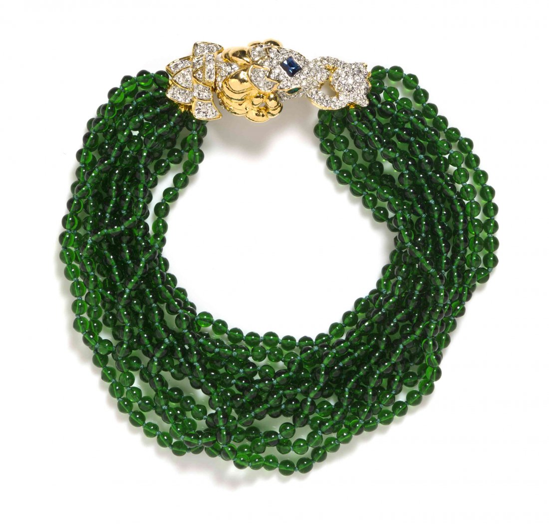 A Kenneth Jay Lane Ram's Head Necklace,: A Kenneth Jay Lane Ram's Head Necklace, eleven faux emerald bead strands with a pave rhinestone ram's head clasp. Stamped: K.J.L.