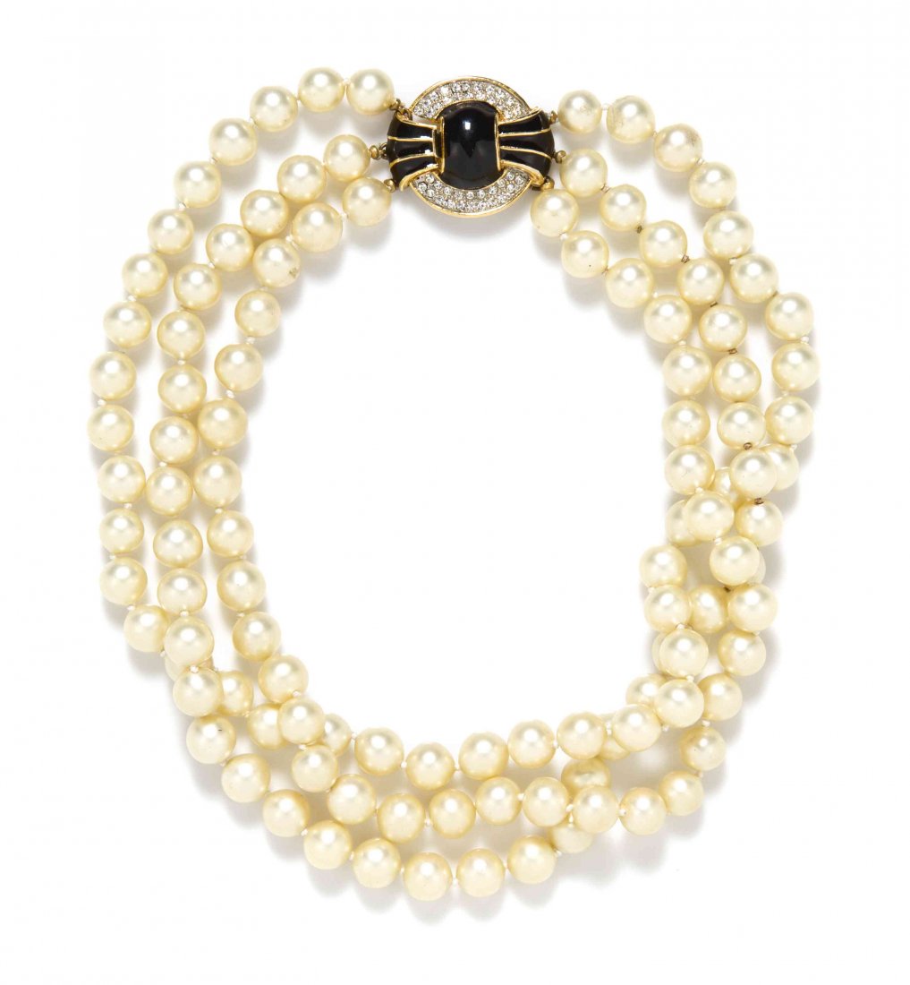 A Kenneth Jay Lane Faux Pearl Necklace,: A Kenneth Jay Lane Faux Pearl Necklace, triple strand of faux pearls with a black enamel and rhinestone clasp. Stamped: K.J.L. Property from an Important Collector, Chicago, Illinois