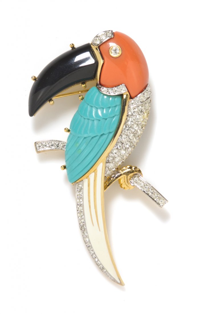 A Kenneth Jay Lane Toucan Brooch,: A Kenneth Jay Lane Toucan Brooch, molded Lucite in onyx, turquoise and coral tones with pave rhinestones accents in a goldtone setting. Stamped: Kenneth Lane.