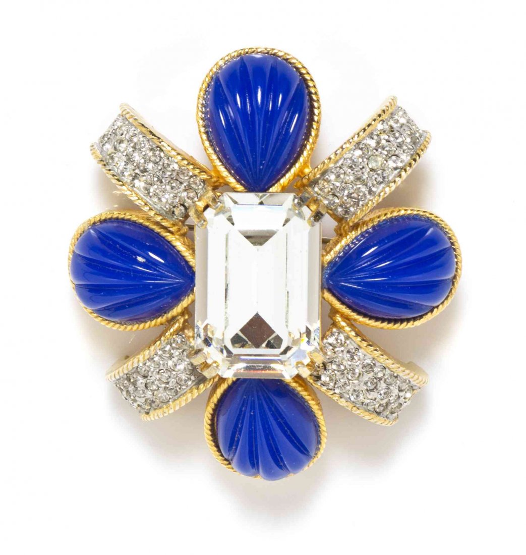 A Kenneth Jay Lane Cobalt Maltese Cross Brooch,: A Kenneth Jay Lane Cobalt Maltese Cross Brooch, four pear shaped cobalt cabochons alternating with rows of pave rhinestones with a large emerald cut rhinestone center in a goldtone setting. Stamped: K