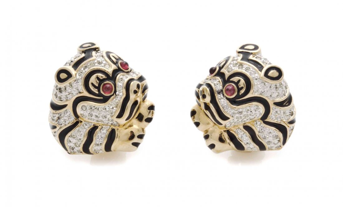 A Pair of Judith Leiber Goldtone Tiger Earclips,: A Pair of Judith Leiber Goldtone Tiger Earclips, with faux amethyst eyes, black enamel stripes and rhinestones accents. Stamped: Judith Leiber. Property from the Estate of Louis M. and Linda M. Byron,