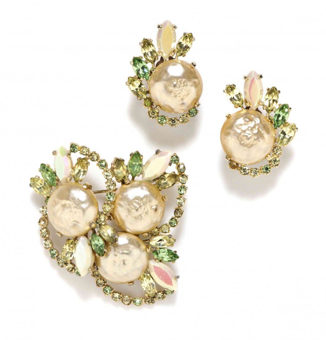 A Schiaparelli Faux Pearl and Multicolor Paste: A Schiaparelli Faux Pearl and Multicolor Paste Demi-Parure, circa 1940, comprised of a brooch and earclips in an organic motif, with green and pink toned rhinestones around baroque button pearls. Stam