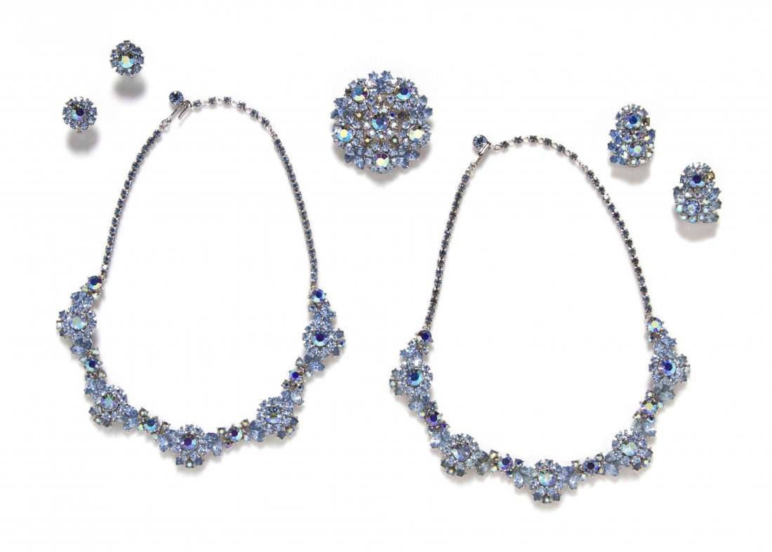 A Trifari Blue Rhinestone Suite,: A Trifari Blue Rhinestone Suite, comprised of two necklaces, two pairs of earclips and a brooch. All stamped: Trifari. Property from an Important Collector, Chicago, Illinois