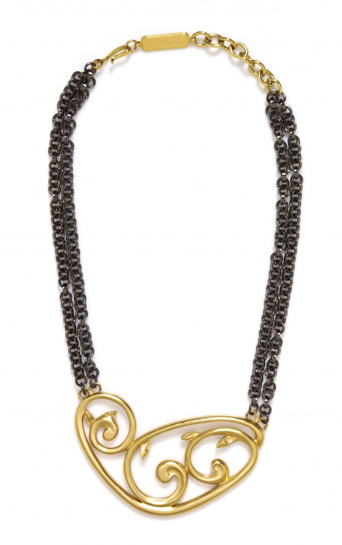 An Yves Saint Laurent Goldtone and Gunmetal Necklace,: An Yves Saint Laurent Goldtone and Gunmetal Necklace, with a goldtone vine motif pendant. Stamped: Yves Saint Laurent / 187/500. Property from the Collection of Carole Tanenbaum