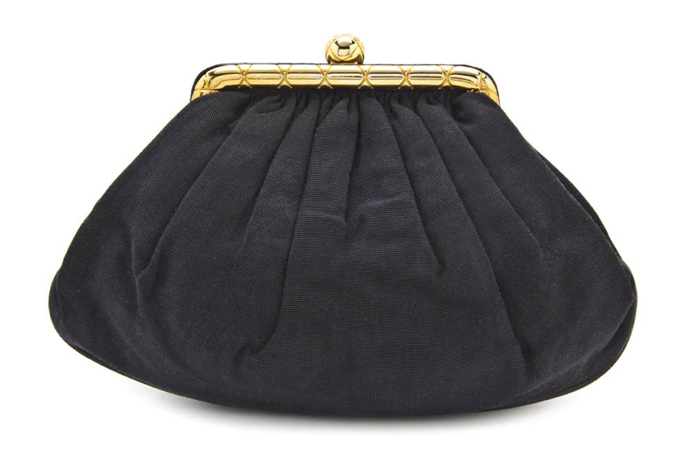 A Chanel Black Satin Bag, 8 x 6 x 2 inches.: A Chanel Black Satin Bag, goldtone purse clasp closure, with interior zippered pocket. Stamped Chanel. 8 x 6 x 2 inches.