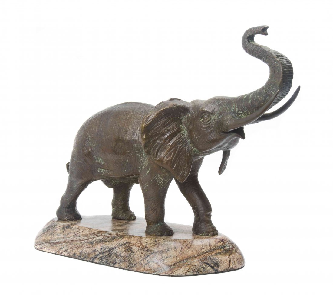 A Bronze Figure of an Elephant, Height of bronze 8 1/2: A Bronze Figure of an Elephant, having a raised trunk, raised on a marble base. Height of bronze 8 1/2 x width 12 3/4 inches. Property from the Collection of Jane Parks Kutza, Bonita Springs, Florida