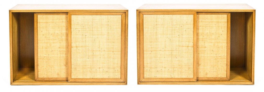 A Pair of Mid-century Modern Hanging Wall Cabinets,: A Pair of Mid-century Modern Hanging Wall Cabinets, Edward Wormley for Dunbar, each bleached mahogany with cloth panelled sliding doors enclosing a glass shelved interior. Height 26 1/8 x width 40 x d