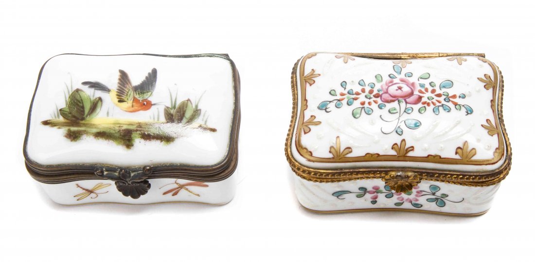 Two French Pill Boxes, Length of longer 2 1/4 inches.: Two French Pill Boxes, both rectangular, one enamel with floral and white relief decoration, the other porcelain with the lid painted with a bird in flight and the body with dragonflies. Length of lon