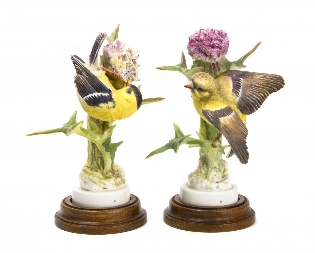 A Pair of Royal Worcester Dorothy Doughty Birds,: A Pair of Royal Worcester Dorothy Doughty Birds, Goldfinches, perched on a purple thistle. Height 8 inches. Property from the Estate of Barbara Archer Thomas, Naples, Florida