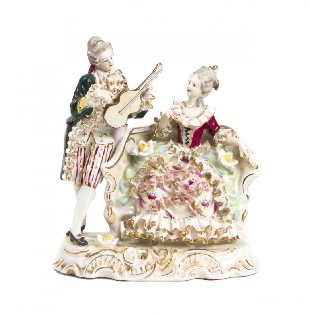 A German Porcelain Figural Group, Height 8 1/2 inches.: A German Porcelain Figural Group, depicting a man with a violin and a seated woman. Height 8 1/2 inches. Property from the Estate of Gyula Serfozo, Boca Raton, Florida.
