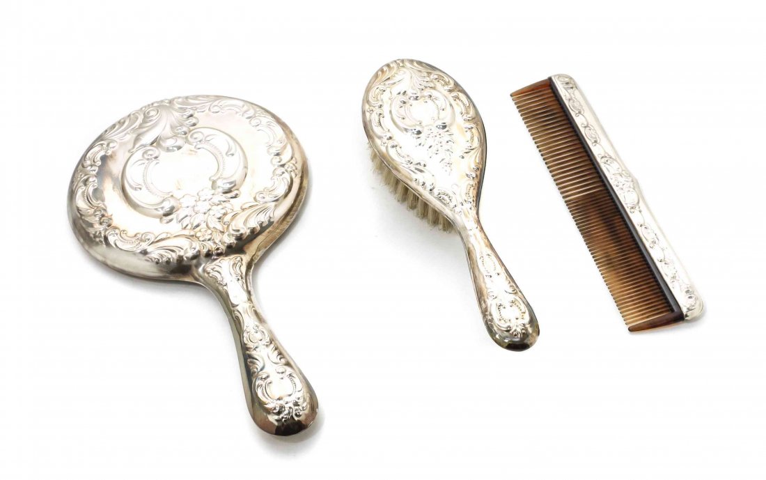 An American Silver Dresser Set, Wallace Silversmiths,: An American Silver Dresser Set, Wallace Silversmiths, Wallingford, CT, Second Half 20th Century, comprising a hand mirror, hair brush and comb, embossed with beaded scrolls, flowers and grapes, with o