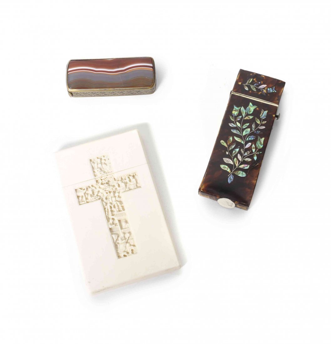 A Collection of Decorative Boxes, Height of the tallest: A Collection of Decorative Boxes, comprising an abalone inlaid tortoise shell traveling sewing kit, a brass mounted hardstone matchbox and a carved ivory card case with a cross on one panel and a figu