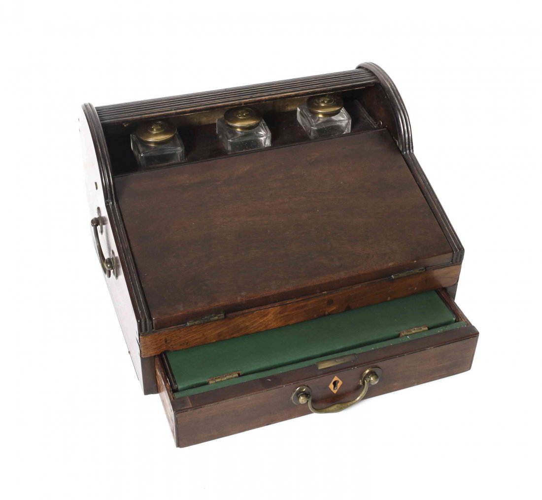 A Mahogany Roll-Top Lap Desk, Height 7 1/2 x width 12: A Mahogany Roll-Top Lap Desk, fitted with ink bottles, a writing slope and a single drawer. Height 7 1/2 x width 12 1/4 x depth 10 1/4 inches.