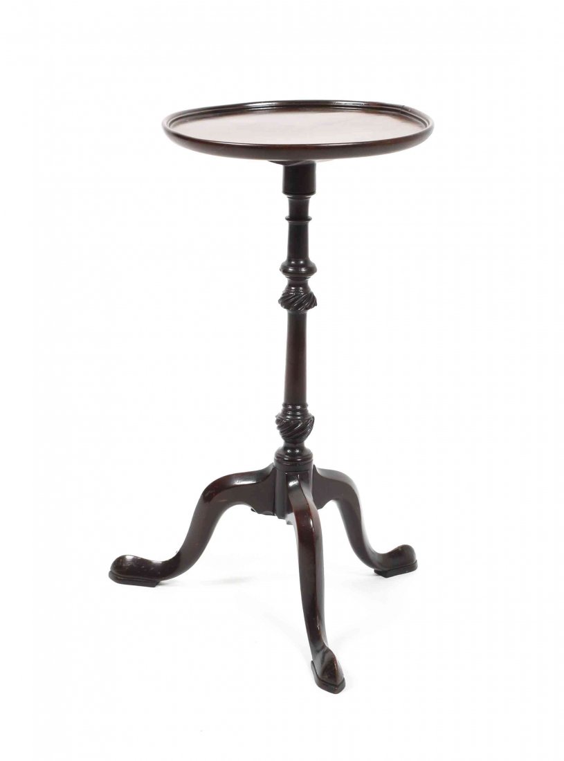 An English Mahogany Candle Stand, Height 22 1/4 x: An English Mahogany Candle Stand, having a turned support raised on a tripod base, ending in pad feet. Height 22 1/4 x diameter 11 1/2 inches. Property from the Estate of Bertha Paglin Ferman, Highlan