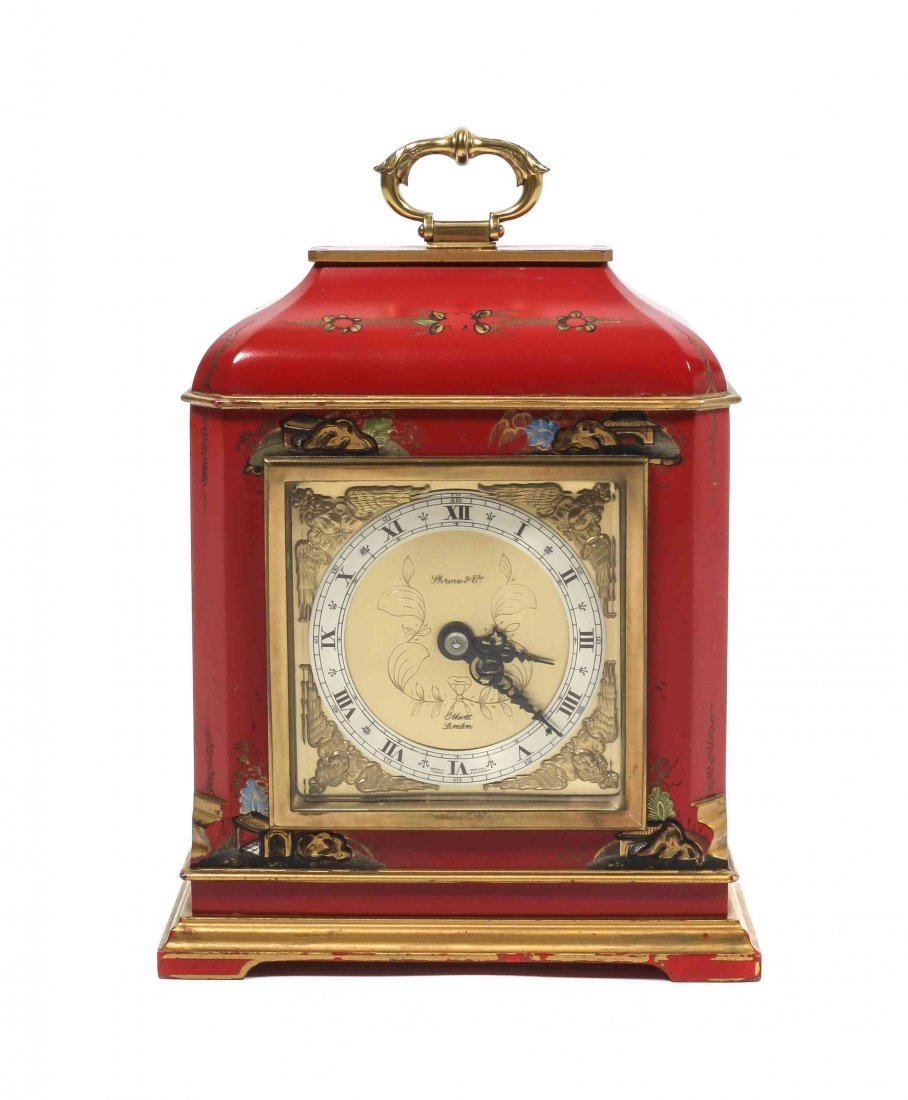 A Red Lacquer Chinoiserie Mantel Clock, Height 10 x: A Red Lacquer Chinoiserie Mantel Clock, retailed by Shreve & Co., the dial by Elliot, London, having a silvered and gilt dial with Roman numeral hours and a French escapement, within a lacquered case.