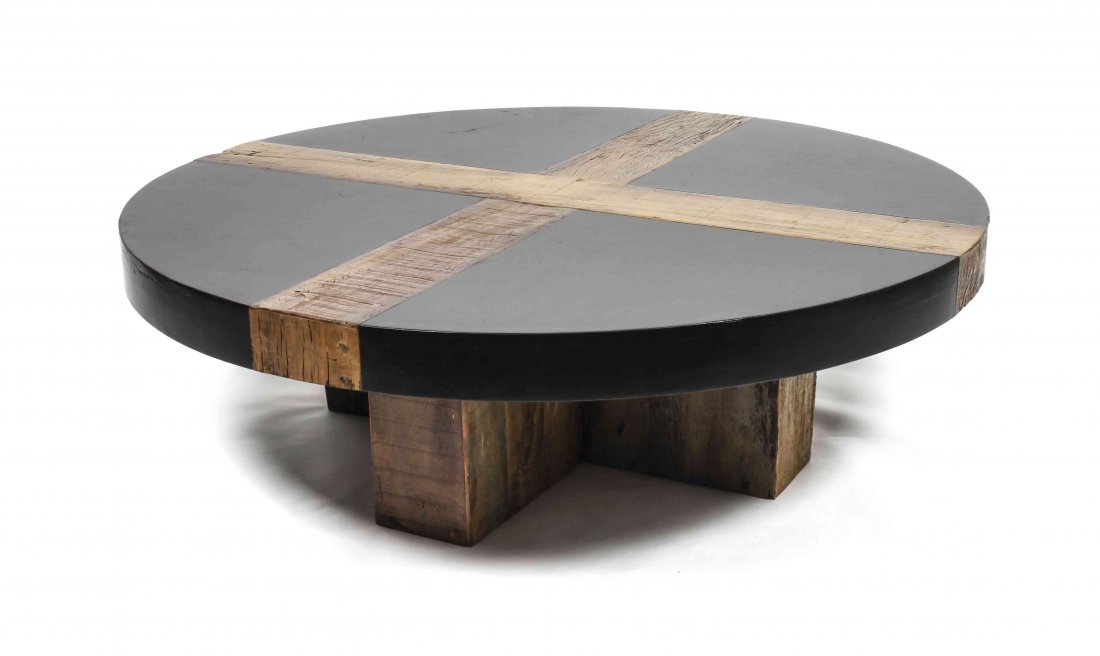 A Circular Ebonized Wood and Oak Low Table, Height 15: A Circular Ebonized Wood and Oak Low Table, in a modernist design, having a circular top with inset oak segments, raised on an X-form oak base. Height 15 1/2 x diameter 51 inches.