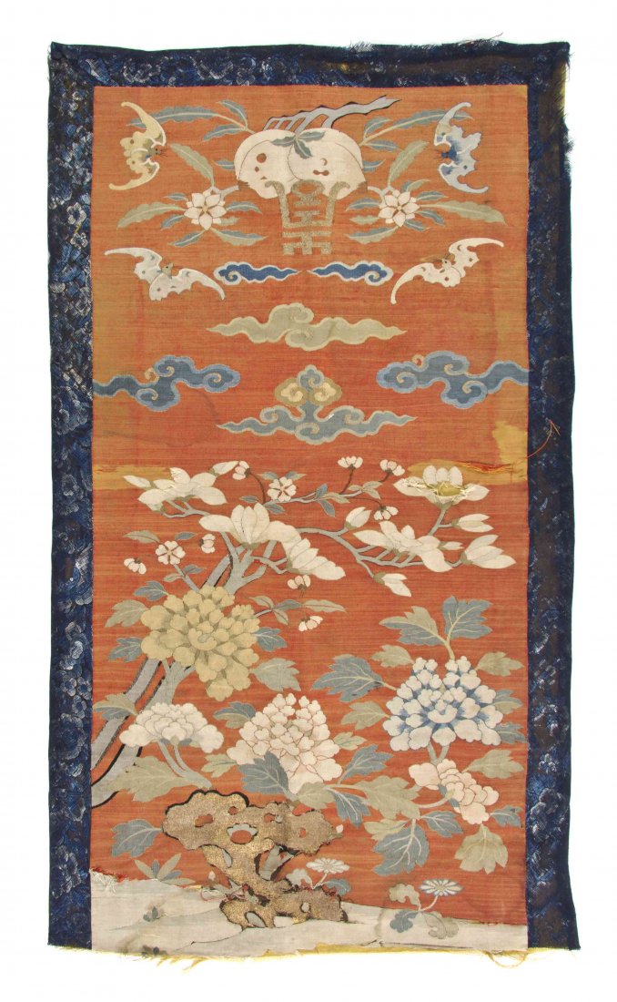 A Chinese Kesi Fragment, Height 32 x width 18 1/2: A Chinese Kesi Fragment, of rectangular, vertical form, having gilt-wrapped thread accents, depicting a flowering rockery beneath peaches and a shou character in a sky of ruyi clouds and bats. Height 