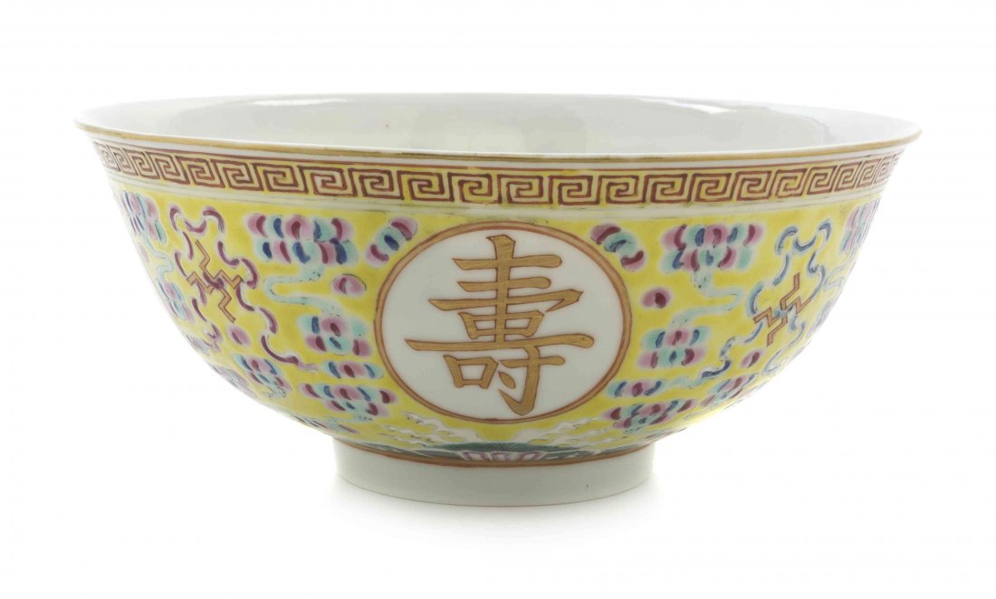A Chinese Porcelain Bowl, Diameter 6 3/4 inches.: A Chinese Porcelain Bowl, of circular form decorated with Buddhist emblems on a yellow ground, bearing Guangxu mark to the underside. Diameter 6 3/4 inches. Provenance: Purchased from the Harry Bridge
