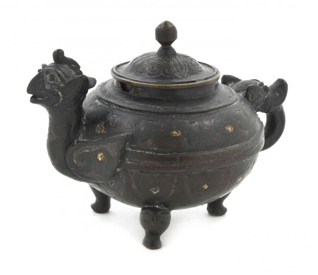 A Chinese Bronze Turtle-Form Tripod Censer, Width at wi: A Chinese Bronze Turtle-Form Tripod Censer, of squat form having a domed lid, the turtle's head raised and the shaped tail forming a handle, raised on shaped squat legs, with gilt painted decoration. 
