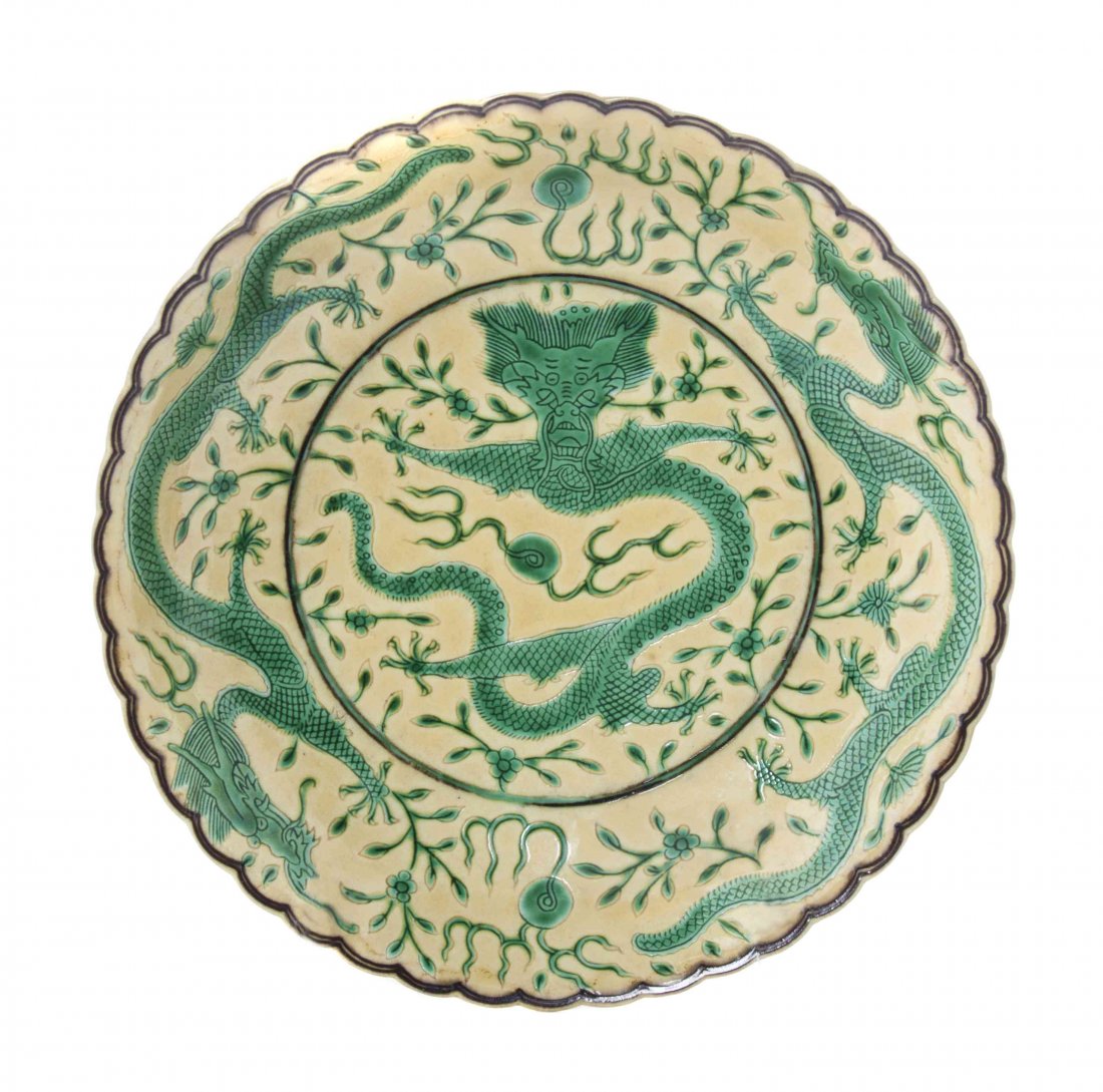 A Chinese Green and Yellow Glazed Dragon Dish, Diameter: A Chinese Green and Yellow Glazed Dragon Dish, with four-character Qing hua zhen pin Guangxu era mark to the underside. Diameter 7 1/2 inches. Property from the Collection of Dr. Stuart Weiss and Mrs.