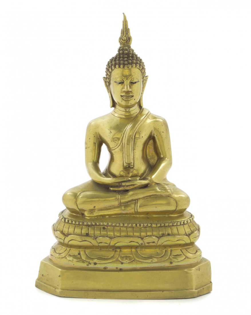 A Thai Gilt Bronze Seated Figure of Buddha, Height 11 1: A Thai Gilt Bronze Seated Figure of Buddha, the figure depicted with a flame-form ushnisha, in draped robes and seated upon a tiered base. Height 11 1/2 inches. Property from the Collection of Richard