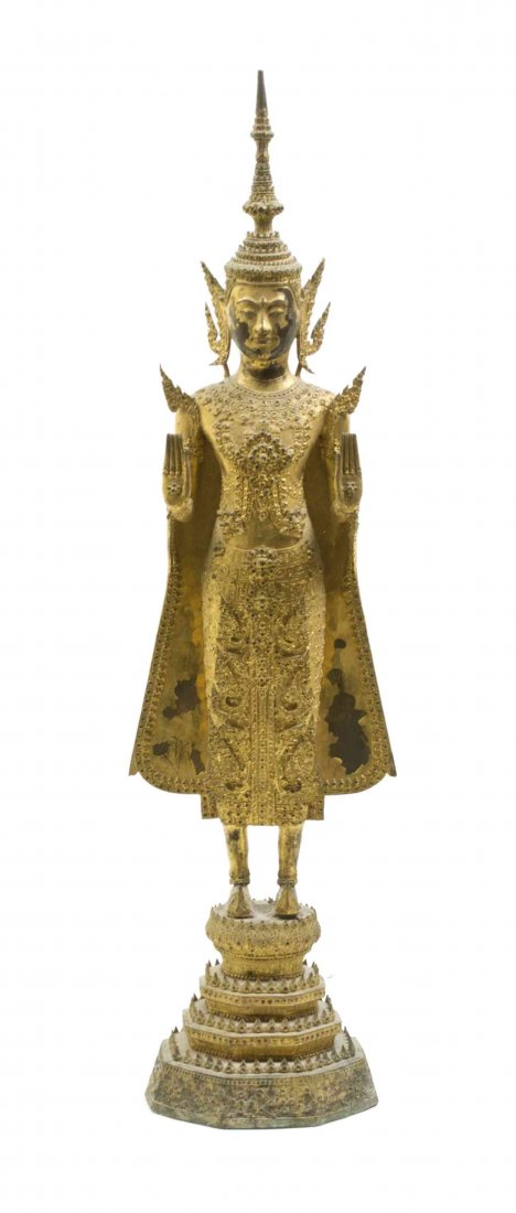 A Thai Gilt Bronze Buddha, Height 33 inches.: A Thai Gilt Bronze Buddha, depicted in a standing pose on a stepped base. Height 33 inches. Property from the Estate of Mr. Emanuel Feingold, Highland Park, Illinois Provenance: Marshall Field, Orient