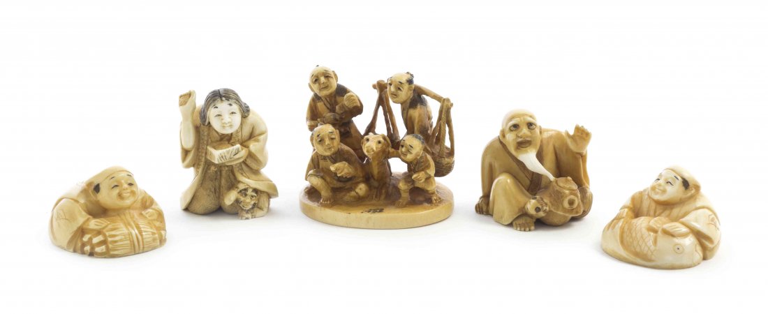 Four Carved Ivory Netsuke, Height of first 3/8 inches.: Four Carved Ivory Netsuke, each tea-stained, the first depicting a bearded man with squirrel and a lidded box, the second depicting a lady holding a package with an oni hiding in her robes, with two o