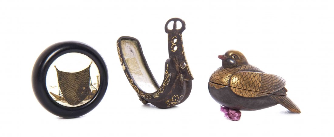 A Group of Three Netsuke, Diameter of manju 1 1/4: A Group of Three Netsuke, comprising a manju, a lacquered wood bird-form box and a metal stirrup-form example. Diameter of manju 1 1/4 inches.