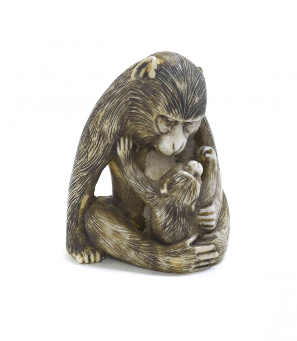 A Mother and Child Monkey Netsuke, Height 1 1/2 inches.: A Mother and Child Monkey Netsuke, the beasts having finely incised fur, depicted embracing, signed. Height 1 1/2 inches. Property from the Collection of Dr. J. Don Nelson, Fargo, North Dakota Provena