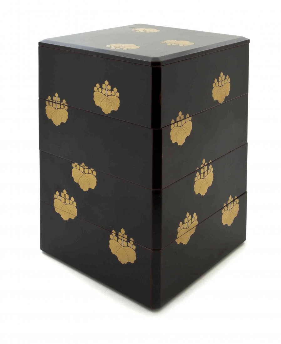 A Japanese Lacquer Box, Height 9 7/8 inches.: A Japanese Lacquer Box, of four tiers with paulownia flower go-shichi-no-kiri crest decoration, with an additional lid. Height 9 7/8 inches.