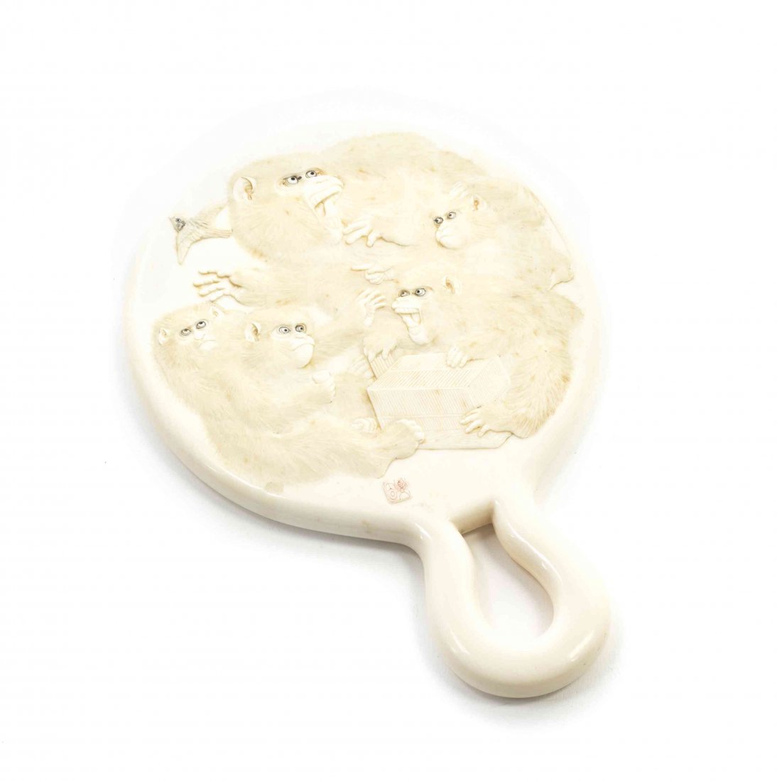 A Japanese Carved Ivory Hand Mirror, Height 7 3/4: A Japanese Carved Ivory Hand Mirror, of circular, loop-handled form, the back relief carved depicting a group of monkeys, having a signature cartouche. Height 7 3/4 inches.