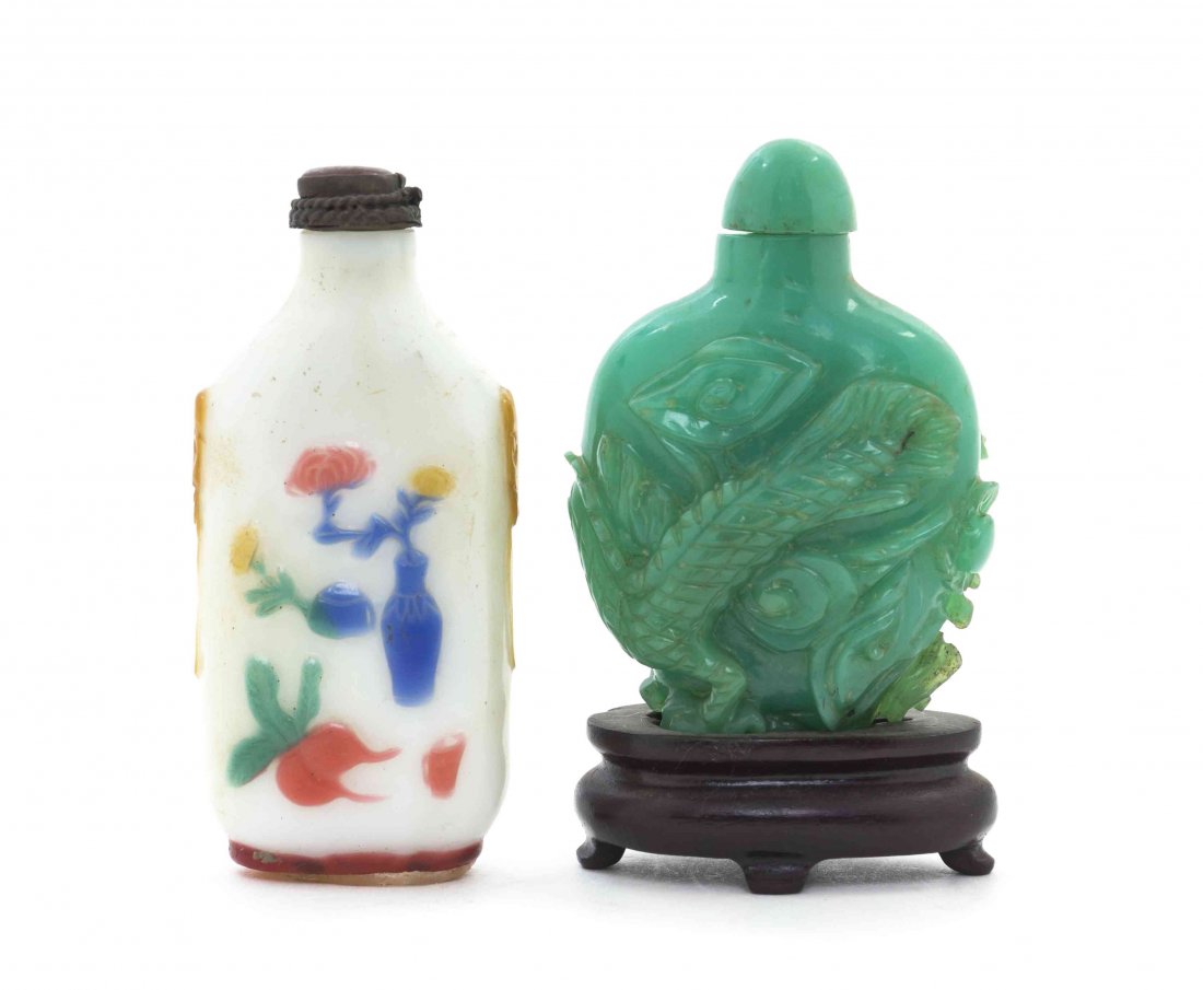 Two Peking Glass Snuff Bottles, Height of first 10 5/8: Two Peking Glass Snuff Bottles, one having multicolor overlay depicting vessels on an opaque white ground, inscribed Zheng Ke, the other of an opaque green glass, raised on a hardwood stand. Height of